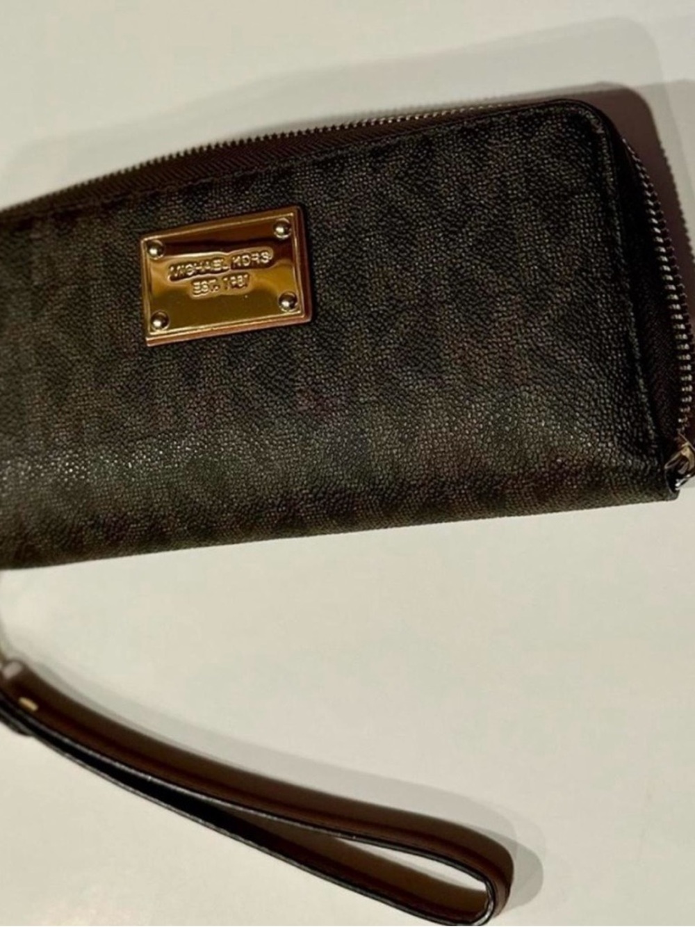 Michael Kors Black Wristlet with Gold Logo Plate
